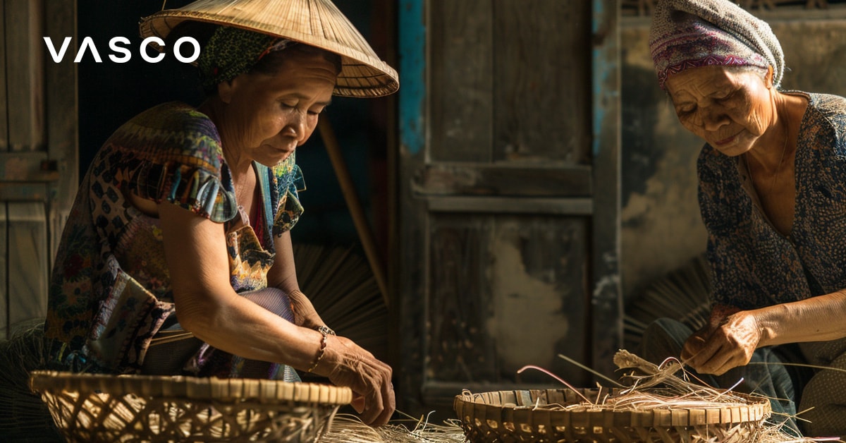 Twee vrouwen werken binnenshuis met manden. Uitbeelding van de Vietnam-vakantie in oktober.